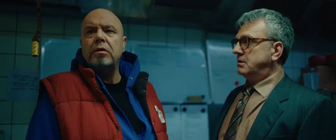 Vlinderman: the bald keeper and the bespectacled director talk in the cold blue zoo kitchen