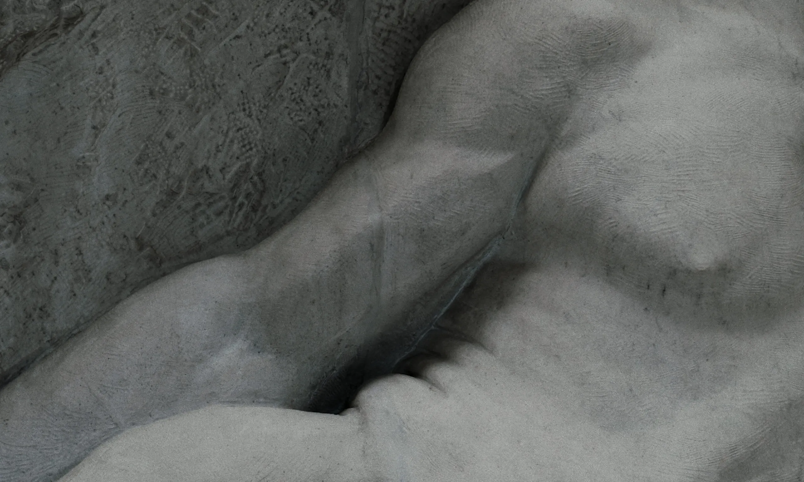 Les Homards Immortels: marble sculpture detail of a muscular arm stretched across a reclining nude torso